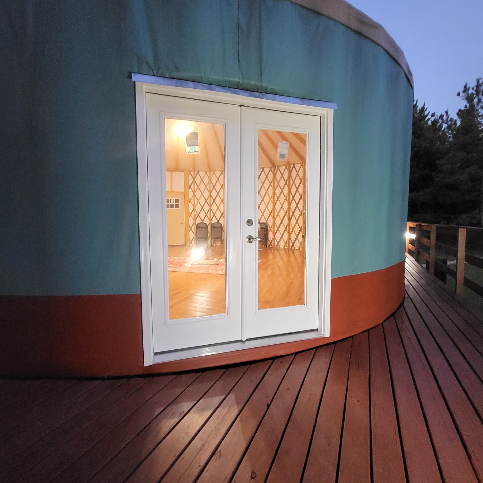 Yurt double doors opening onto the deck